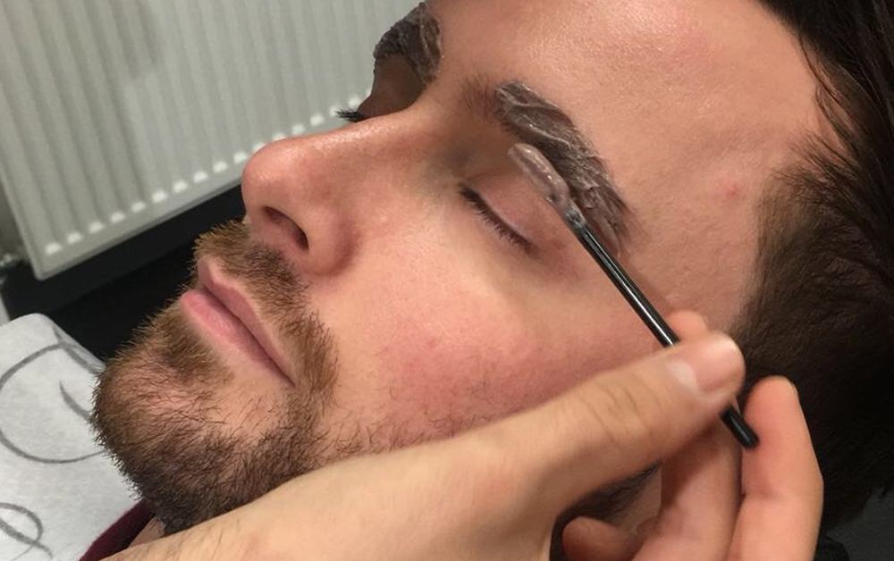 Men doing their eyebrows