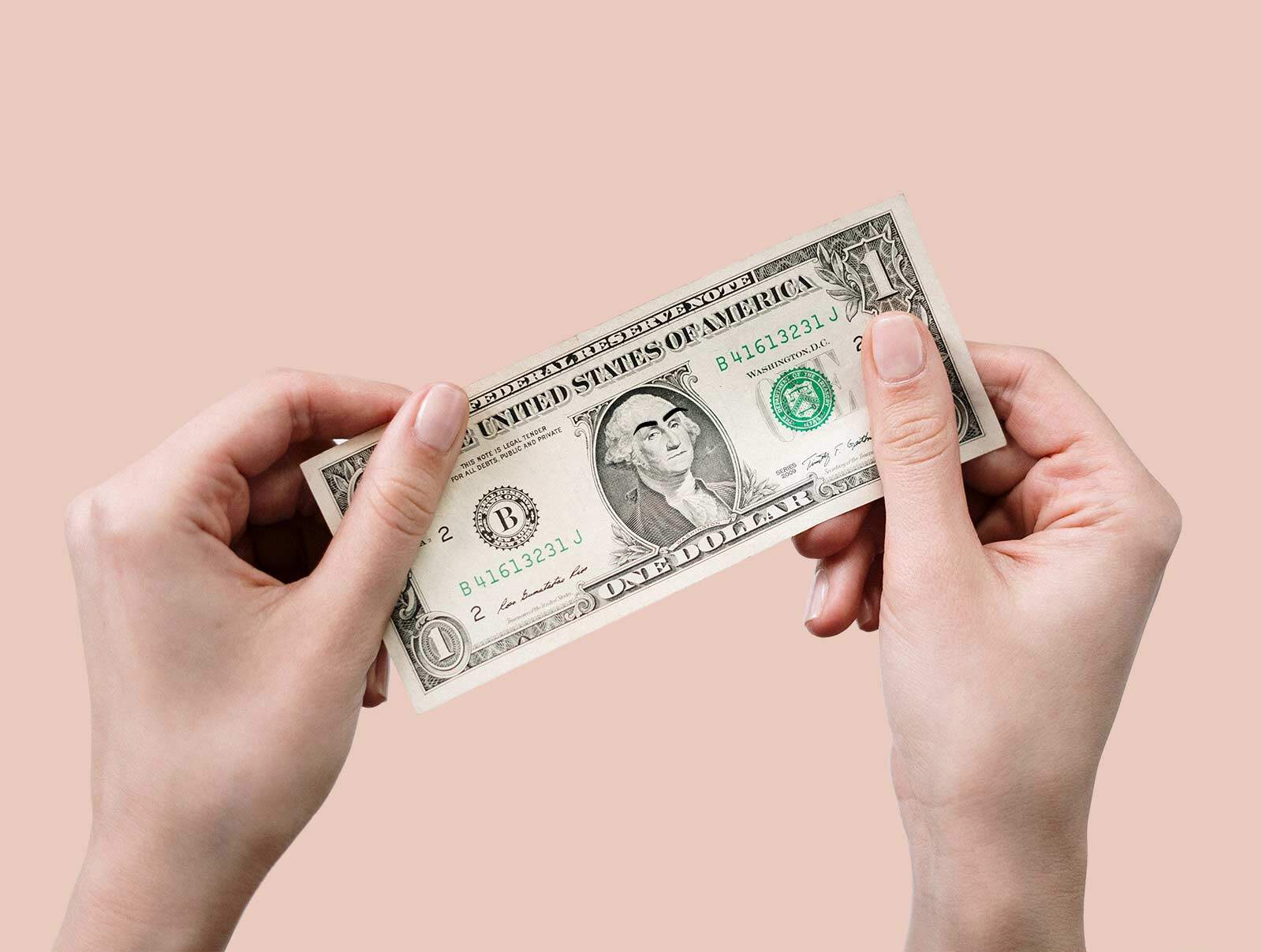hands holding dollar note